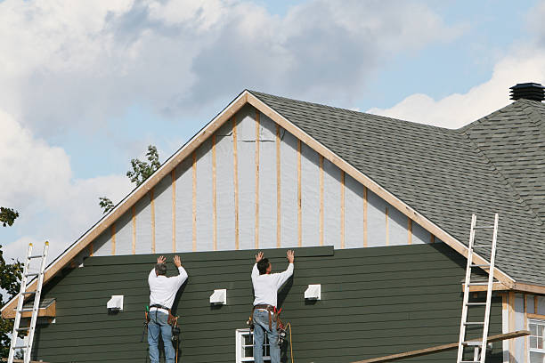 Professional Siding technician working in Piqua, OH
